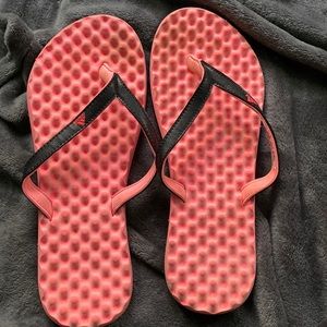 Pink and black Adidas flip flops